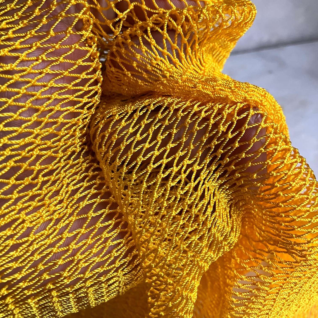Exfoliating shower towel